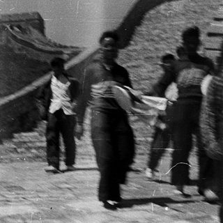 People walking on Great Wall ruins.