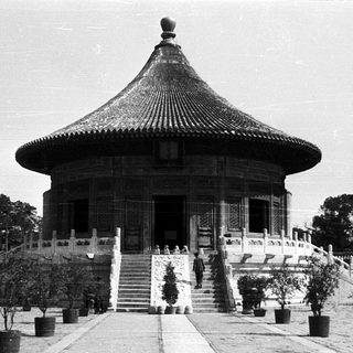 Traditional East Asian pavilion with curved tiled roof.