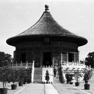Traditional East Asian pavilion with curved tiled roof.
