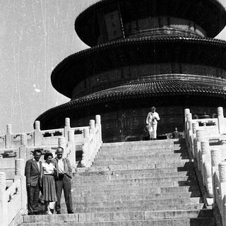 Three men posing on steps of Temple of Heaven.