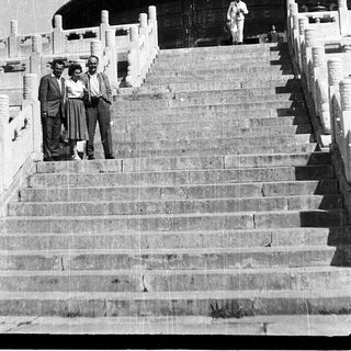 Three men posing on steps of Temple of Heaven.
