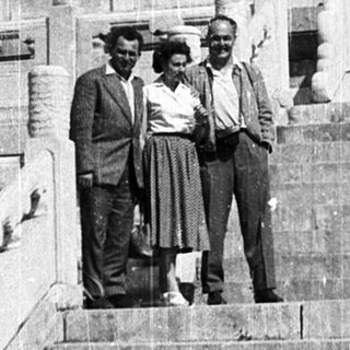 Three men posing on steps of Temple of Heaven.