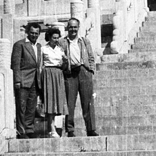 Three men posing on steps of Temple of Heaven.
