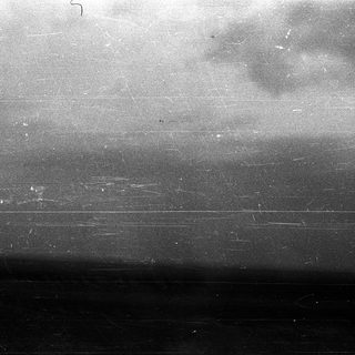Blurred view of a cloudy sky.
