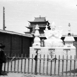 Black-and-white photo of traditional East Asian temple gate.