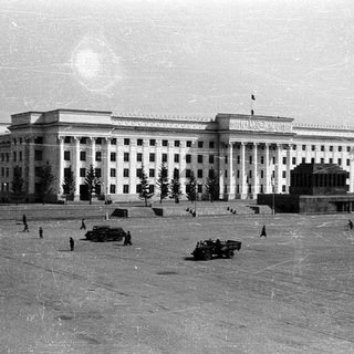 Large Soviet-era government building with open plaza.