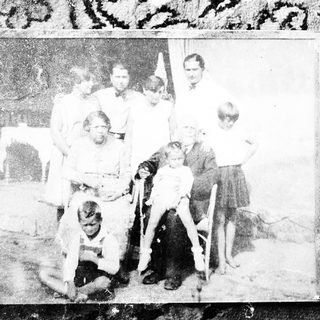 Family group portrait from mid-20th century.