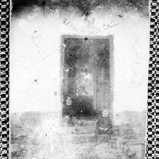 Vintage photo of a damaged negative showing a chair.