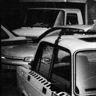 Taxi vehicles parked in a row.