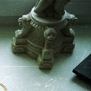 Broken jewelry on a window sill.