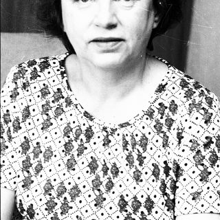Black-and-white portrait of an older woman.