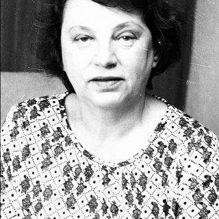Black-and-white portrait of an older woman.