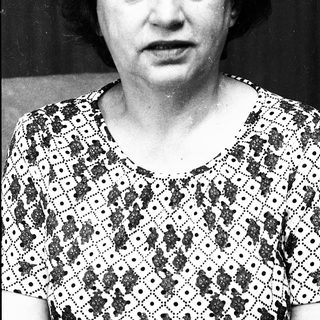 Black-and-white portrait of an older woman.