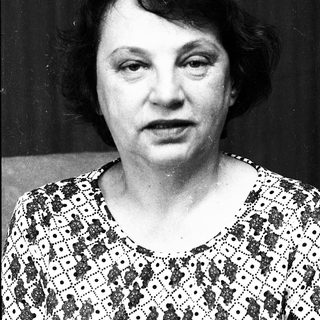Black-and-white portrait of an older woman.