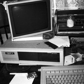 Vintage desktop computer setup with CRT monitor.
