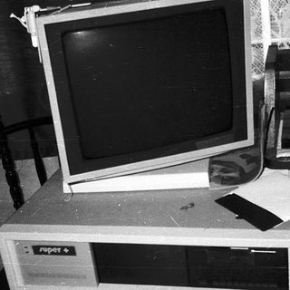 Vintage desktop computer setup with CRT monitor.