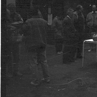 People gathered indoors during a gathering or event.