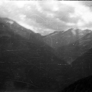 Mountain landscape with cloud cover.