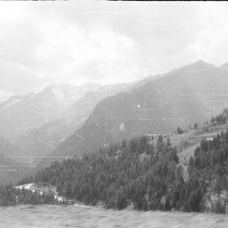 Mountainous landscape with dense forest cover.