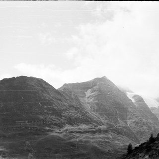 Mountainous landscape with mist-covered peaks.