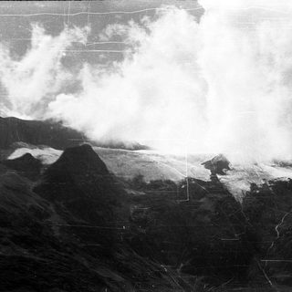 Volcanic eruption with dense ash cloud.