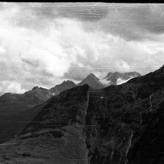 Majestic mountains shrouded in clouds.