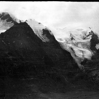 Majestic snow-covered mountain peaks and glaciers.