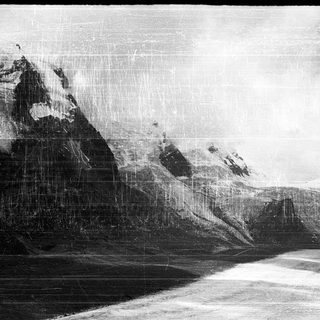 Mountainous landscape with snow-covered peaks.