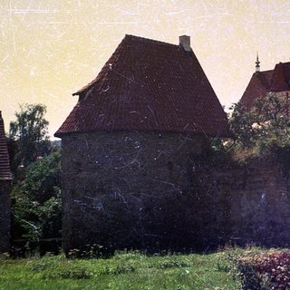Historic town with medieval architecture and church tower.