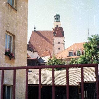 Historic European town with church tower.