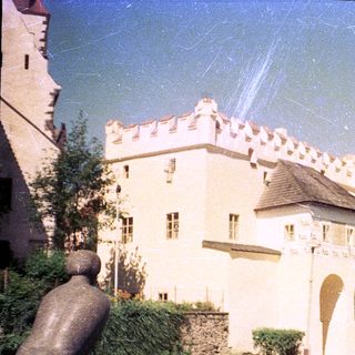 Medieval-style castle with crenellated walls and towers.