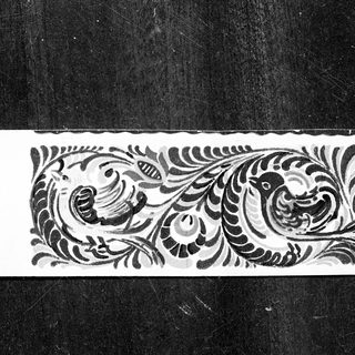 Elegant black and white feathered ornamental design.