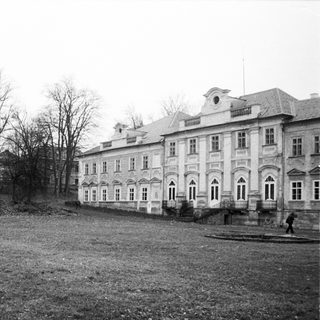 Neoclassical building in a park-like setting.
