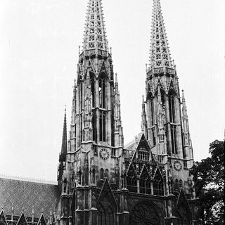 Gothic cathedral twin spires with intricate stonework.