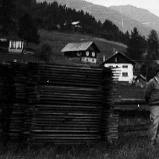 Man standing in rural alpine village.