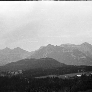 Mountainous landscape with snow-capped peaks.