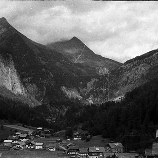 Mountain village nestled in valley.