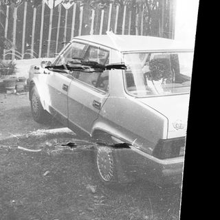 Classic car stuck in flooded road.