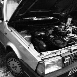 Vintage car with open hood, classic engine bay.