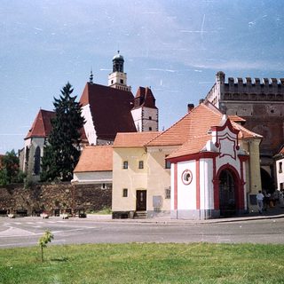 Historic European town with medieval architecture and church.