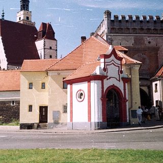Historic European town with medieval architecture and church.