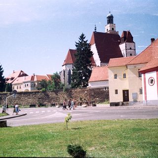 Historic European town with castle ruins and church.