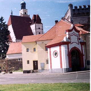Historic European town with castle ruins and church.