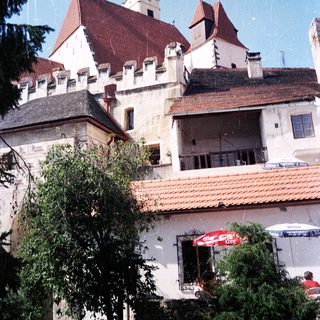 Medieval-style castle with red-tiled roofs.