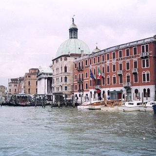 Venetian canal with historic buildings and boats.