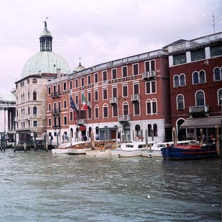 Venetian canal with historic buildings and boats.