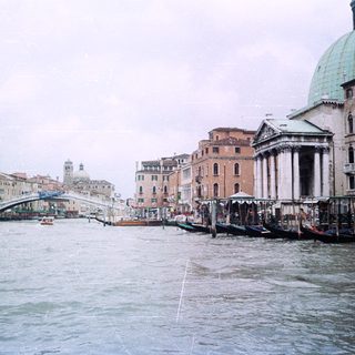 Venetian canal with historic buildings and gondolas.