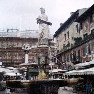 Statue fountain in historic European square.