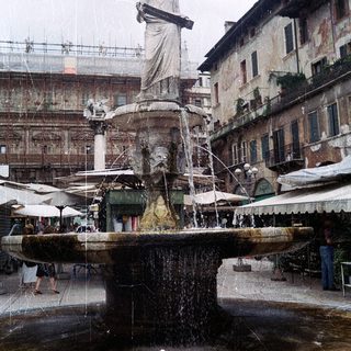 Statue fountain in historic European square.