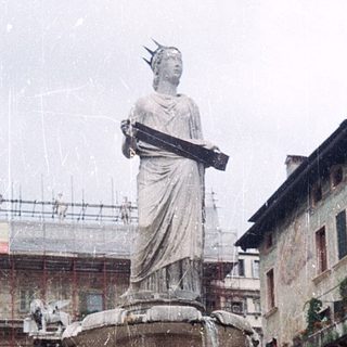 Statue fountain in historic European square.